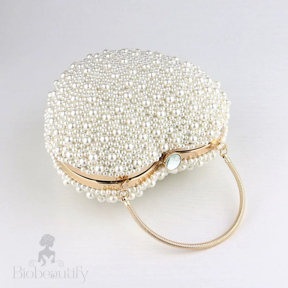 Beige Heart Shaped Clutch Bag With Luxury Metal Handle And Pearl Beads