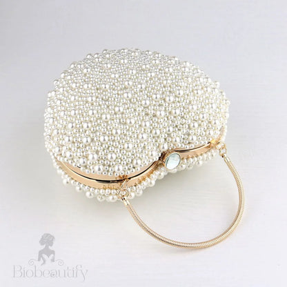 Beige Heart Shaped Clutch Bag With Luxury Metal Handle And Pearl Beads