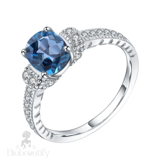 Cubic Zirconia And London Blue Topaz Halo Ring / 10