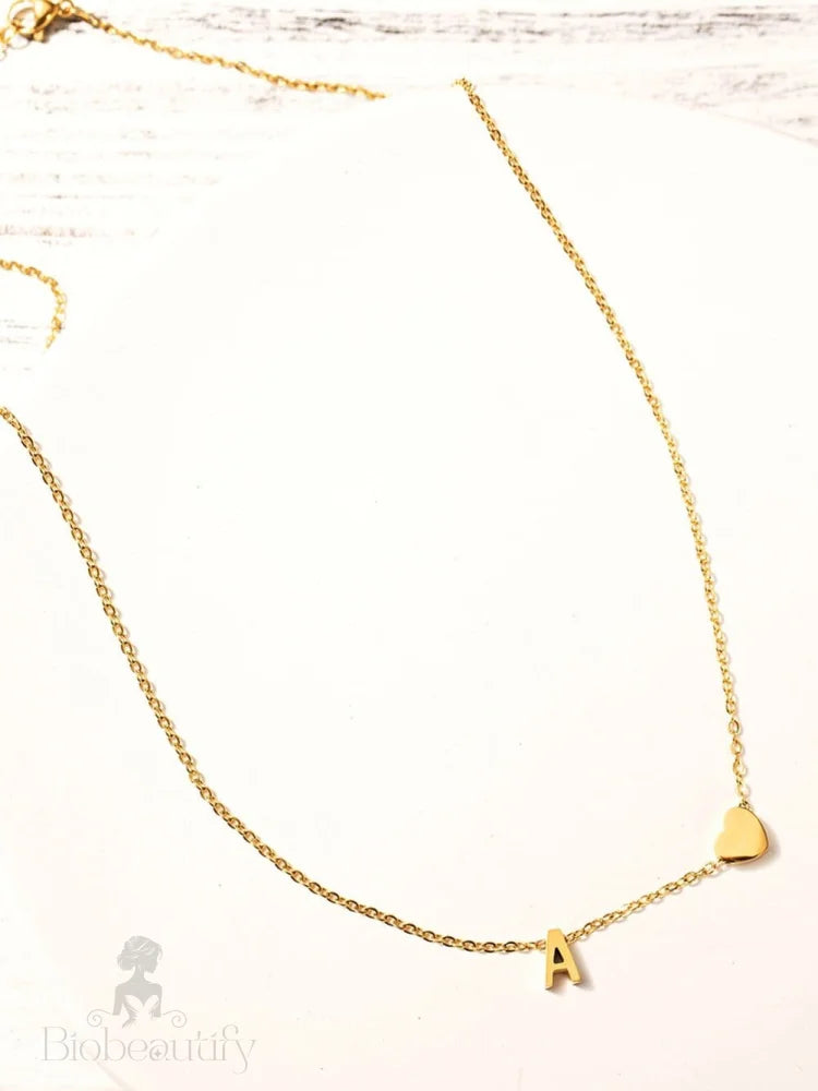 Gold Letter Pendant Necklace With Chained Heart Design