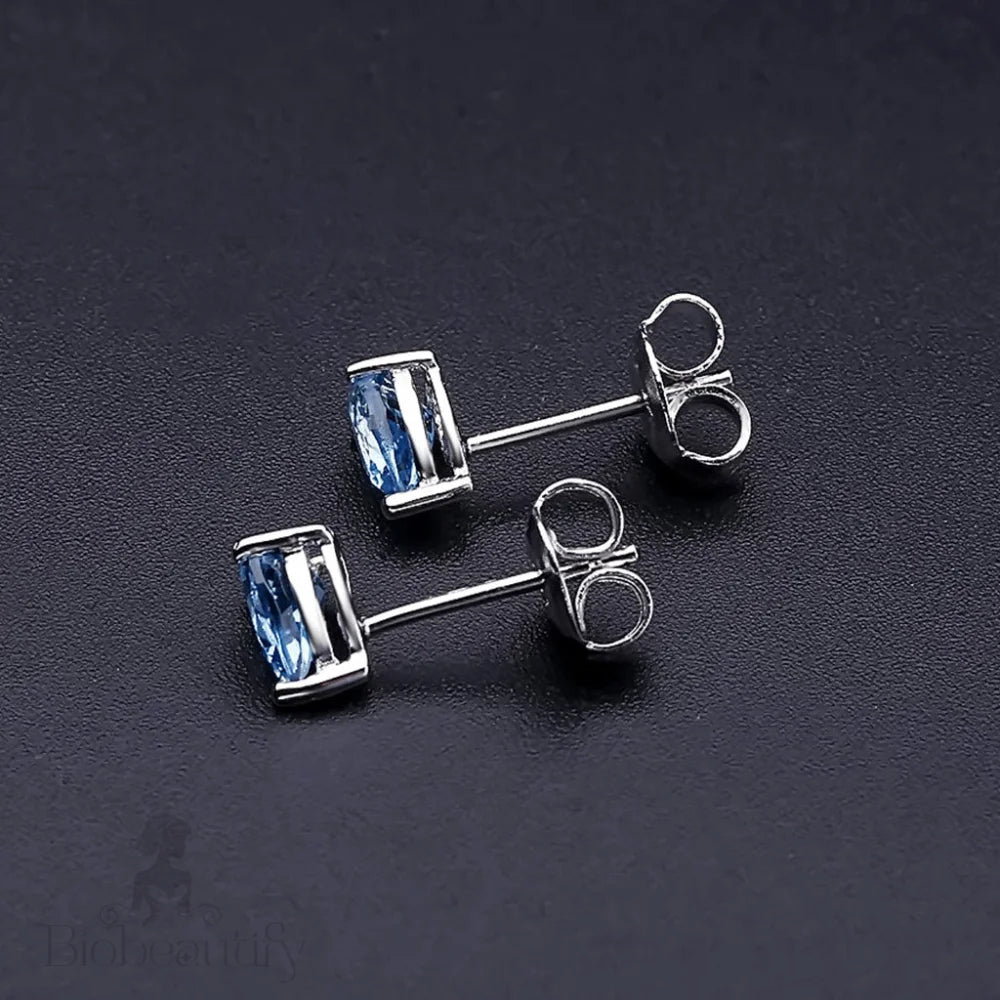 Pear Shaped Swiss Blue Topaz Halo Stud Earrings